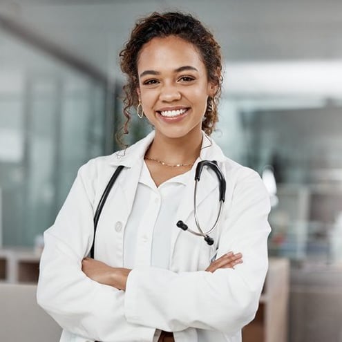 confident-my-medical-ability-cropped-portrait-attractive-young-female-doctor-standing-with-her-arms-folded-office